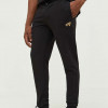 Tommy Jeans pantaloni de trening culoarea negru, melanj